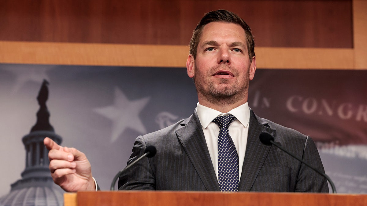 Rep. Eric Swalwell speaks at a podium