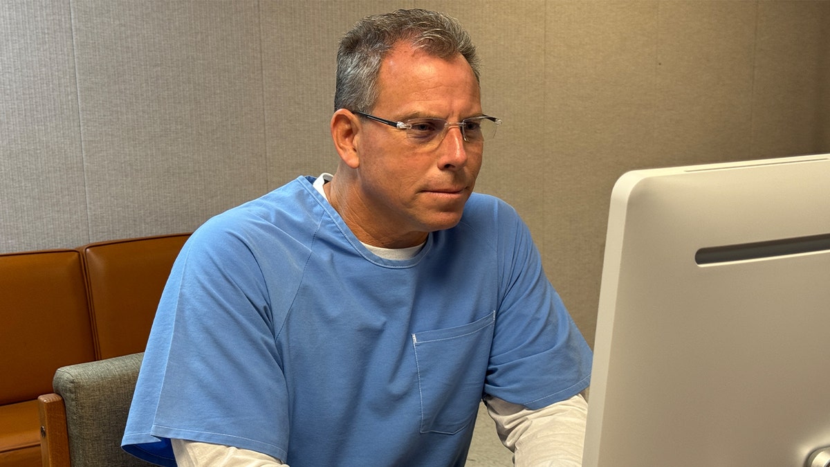 Parole hearing attended by Erik Menendez from a desktop computer.
