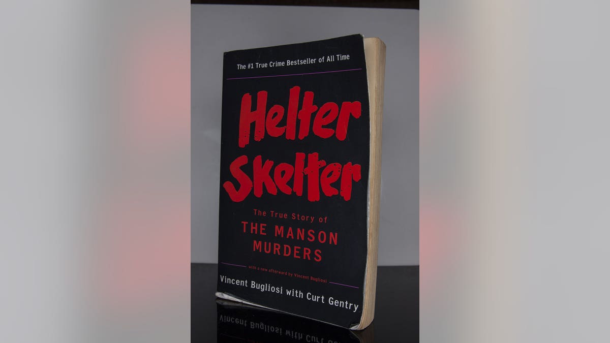 The book Helter Skelter by Vincent Bugliosi and Curt Gentry displayed on a surface.
