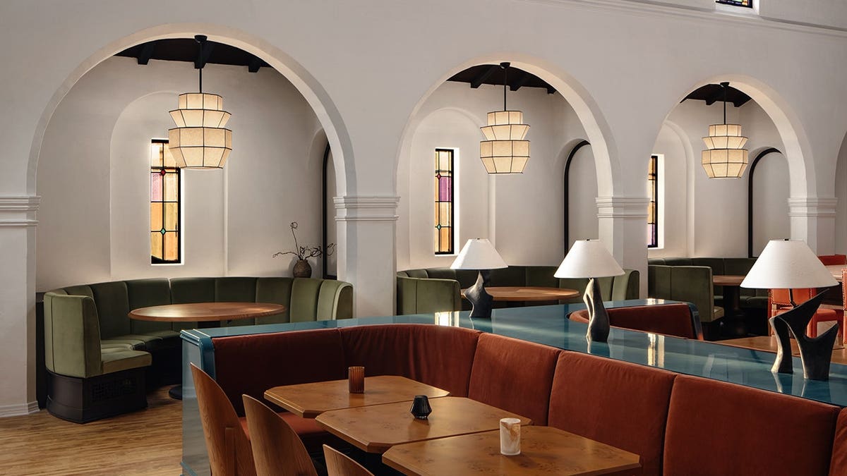 The dining area at Hotel Lucile features stained-glass windows.