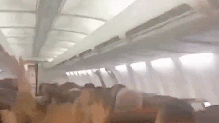 Plane passengers scream in harrowing mid-flight video as violent shaking sends cabin ceiling panels flying