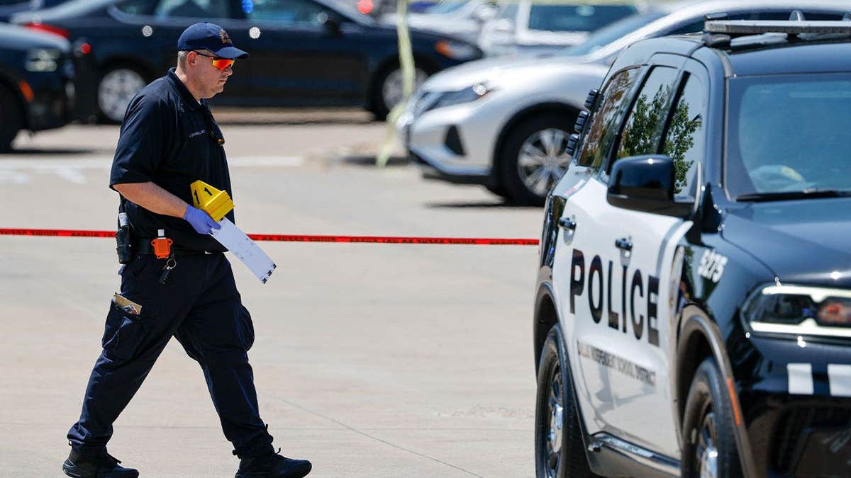 Dallas police investigate the scene where a Dallas ISD officer was shot in a Sam’s Club parking lot on Aug. 6, 2026.