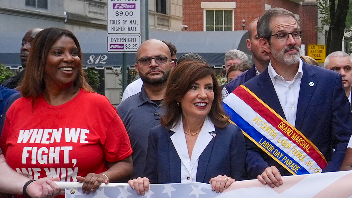 Kathy Hochul and Letitia James marching in a parade