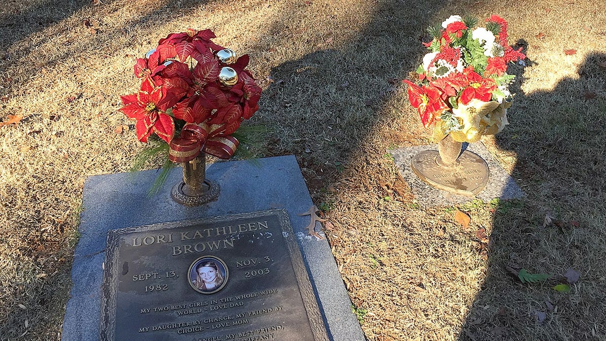 A grave site with flowers
