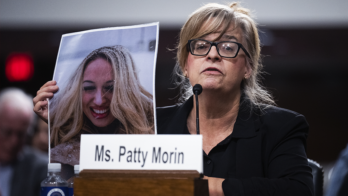 UNITED STATES - DECEMBER 10: Patty Morin holds a picture of her daughter, Rachel, who was allegedly killed by undocumented immigrant in Maryland in 2023, during the Senate Judiciary Committee hearing titled 