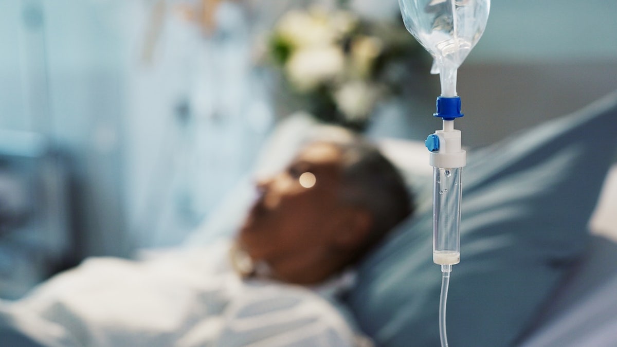 Person at clinic is seen receiving a liquid for infusion service.