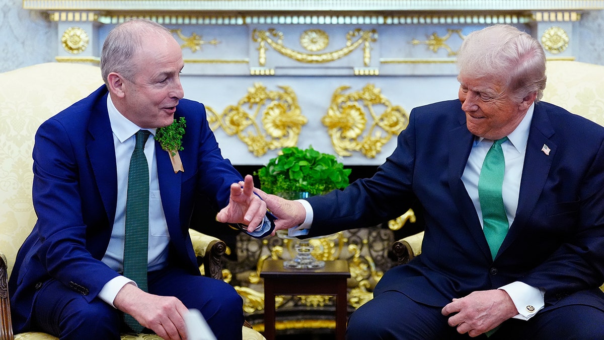 President Donald Trump speaking with Micheál Martin in the Oval Office.
