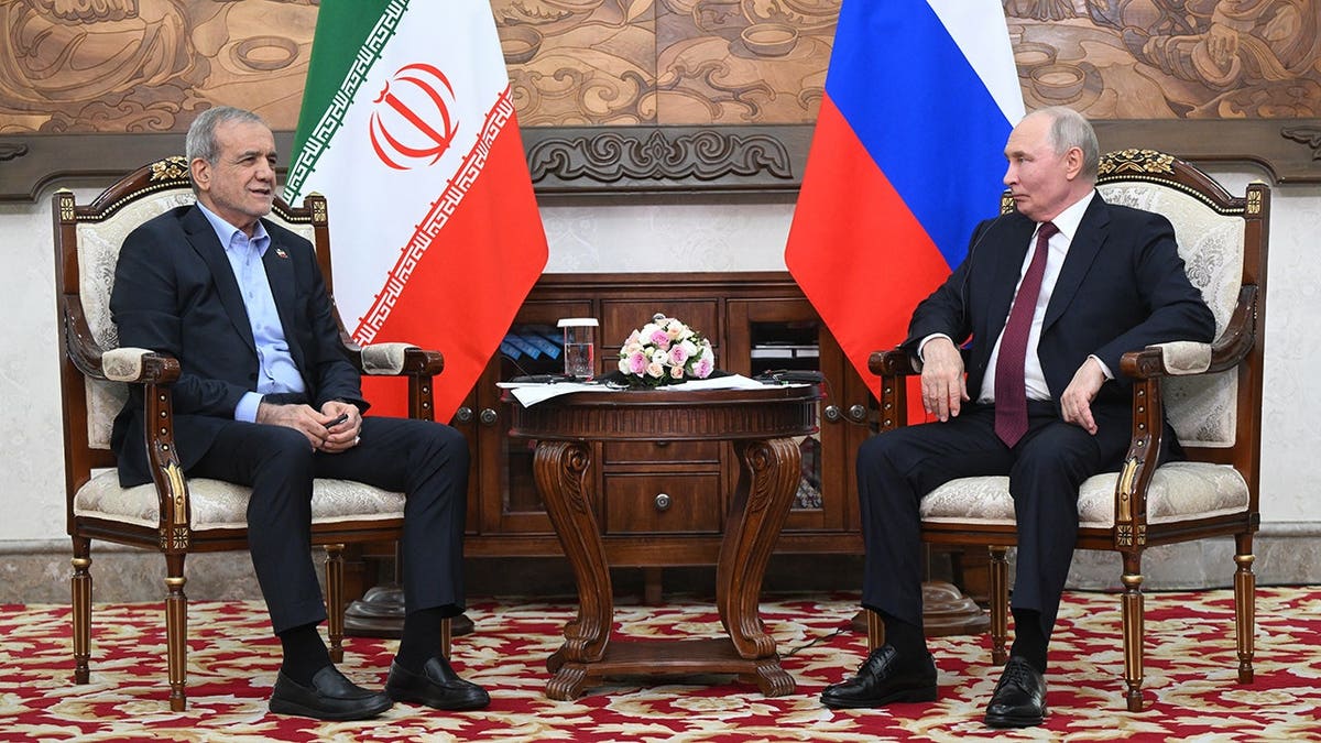 Vladimir Putin and Masoud Pezeshkian talk during their meeting in Bishkek, Kyrgyzstan.