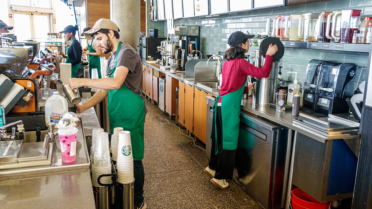 Starbucks baristas at work.