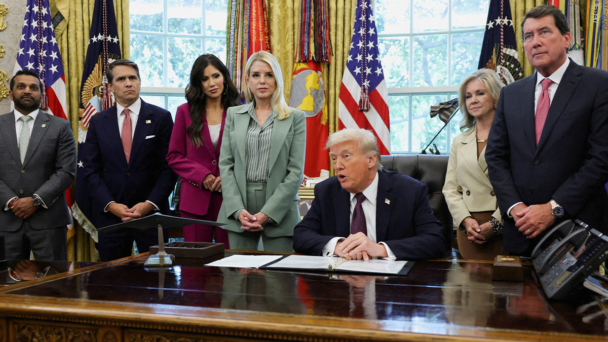 U.S. President Trump signs a memorandum at the White House in Washington