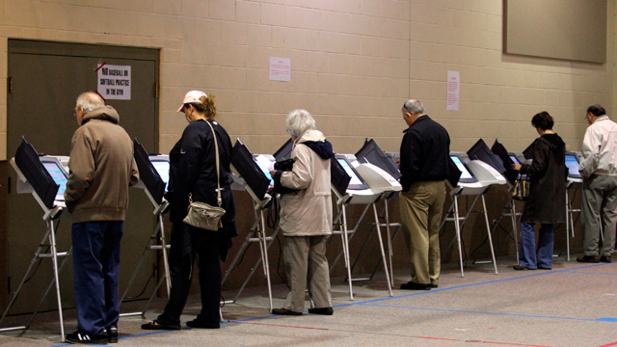 American voters cast their ballots at a polling station during an election.
