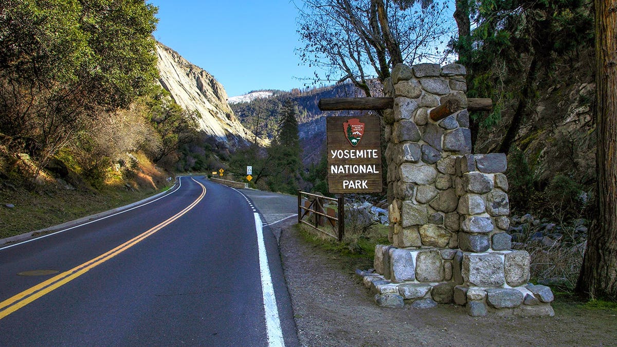 Yosemite National Park entrance sign in early morning light.